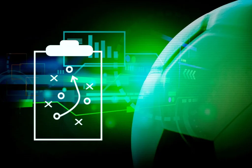 Fußball und daneben eine Taktiktafel fürs Wetten mit System